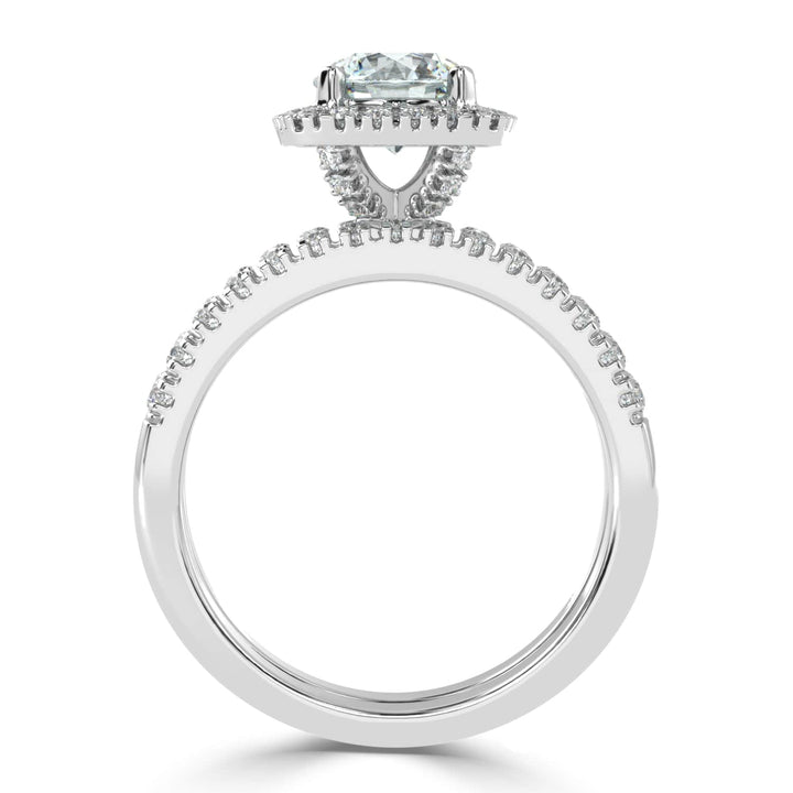 Eternal Brilliance: Round Solitaire Ring with Diamond Halo and Diamond-Studded Shank, paired with a Diamond Accent Band