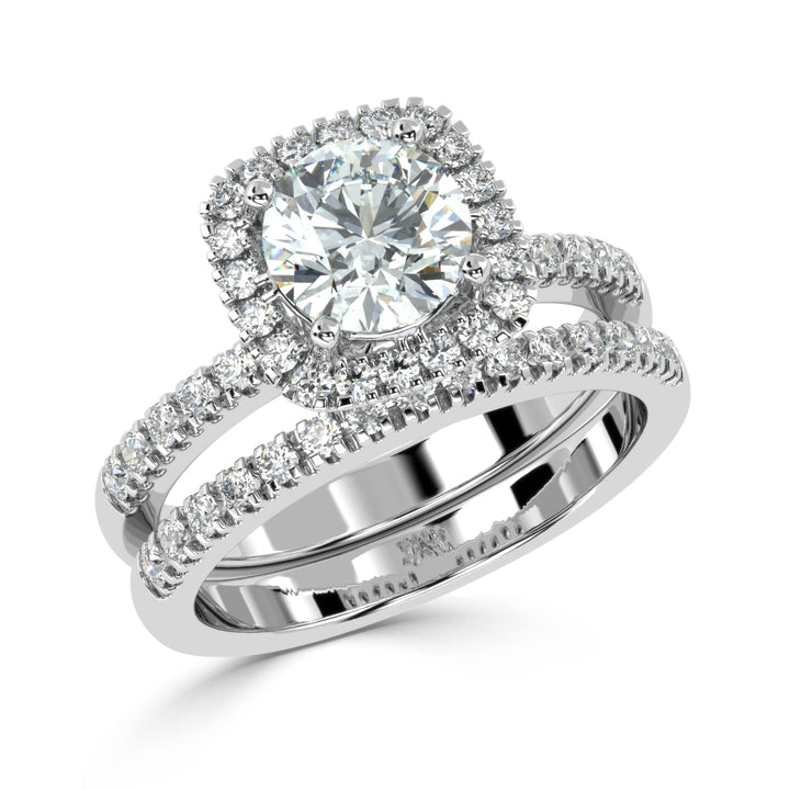 Eternal Brilliance: Round Solitaire Ring with Diamond Halo and Diamond-Studded Shank, paired with a Diamond Accent Band