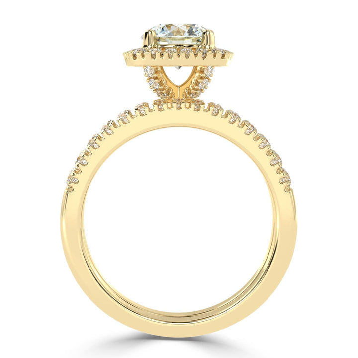 Eternal Brilliance: Round Solitaire Ring with Diamond Halo and Diamond-Studded Shank, paired with a Diamond Accent Band
