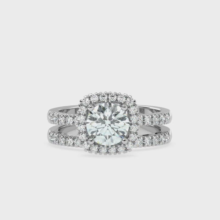 Eternal Brilliance: Round Solitaire Ring with Diamond Halo and Diamond-Studded Shank, paired with a Diamond Accent Band